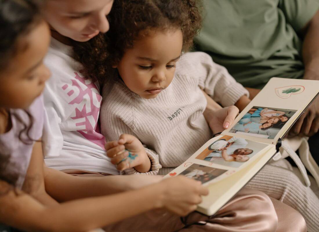 Nostalgic Family looking through a photo album together